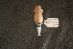 Item G 322 Santa wine bottle stopper $20.00  Maple and stainless steel stand along base